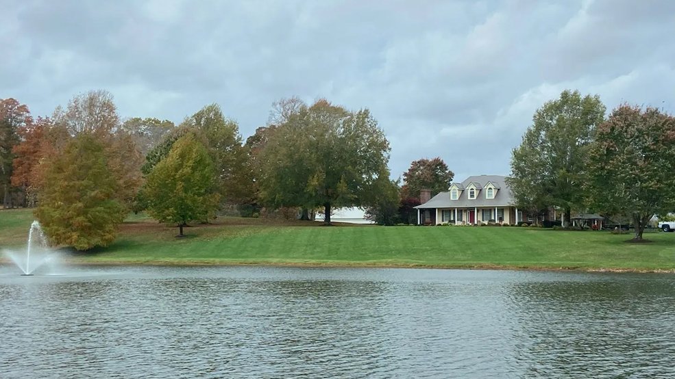 Distant view of a metal shingle roof on a brown home in Murfreesboro, Tennessee