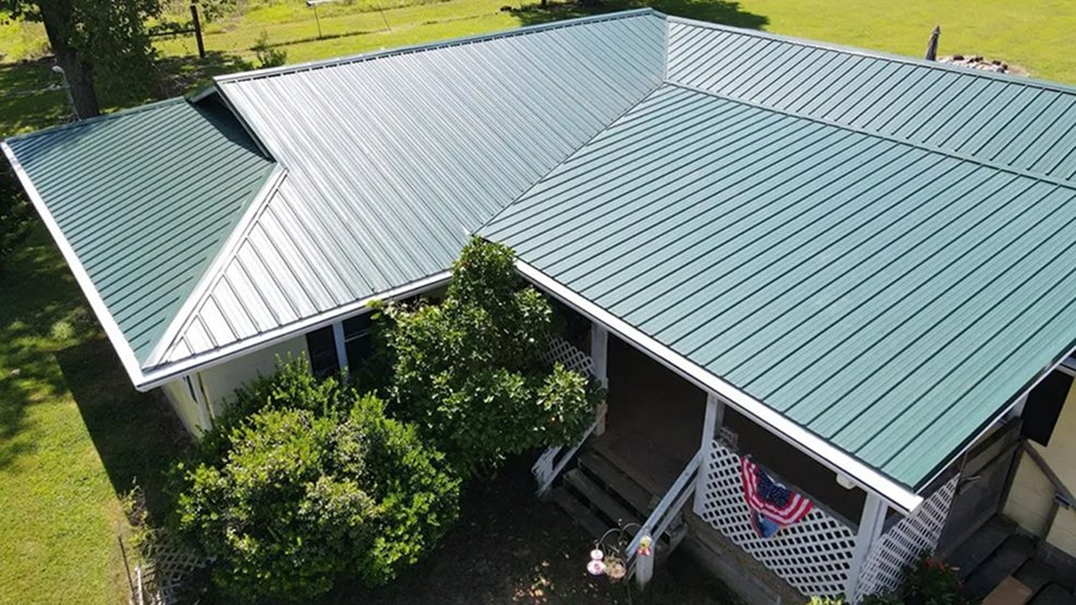 Green traditional exposed fastener metal panel roofing