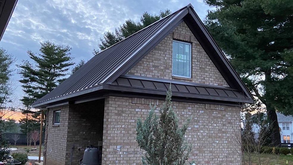 Brown standing seam metal roof on a shed in Middle Tennessee