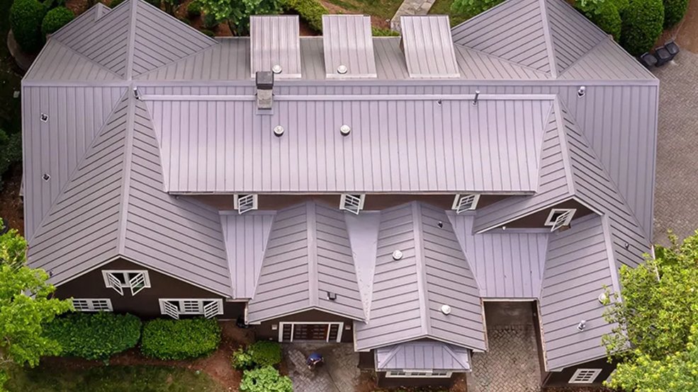Brown standing seam metal roof panels and seam spacing