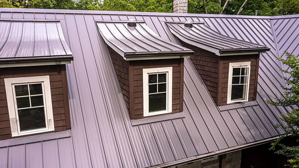 Brown standing seam metal roof panel and ridge