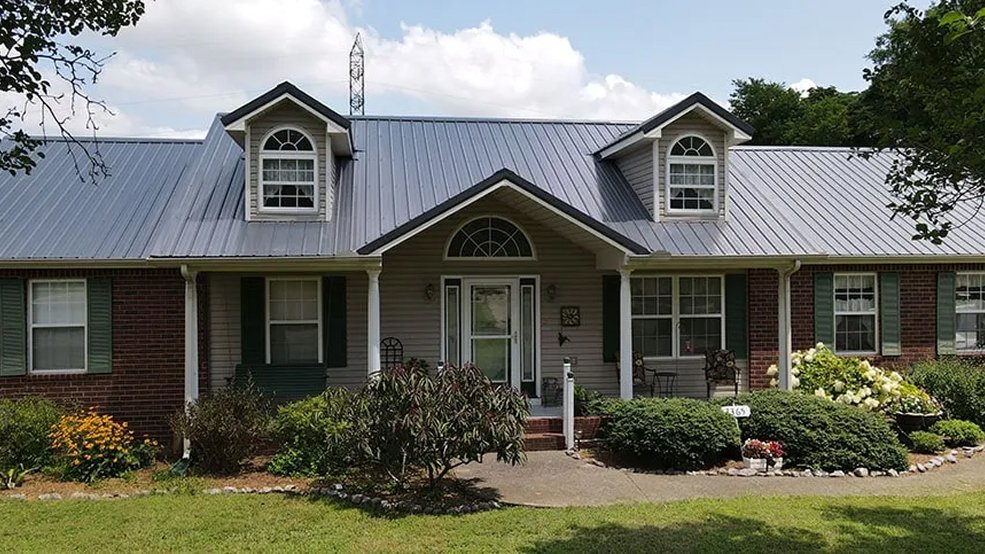 Gray traditional metal roof panel and trim
