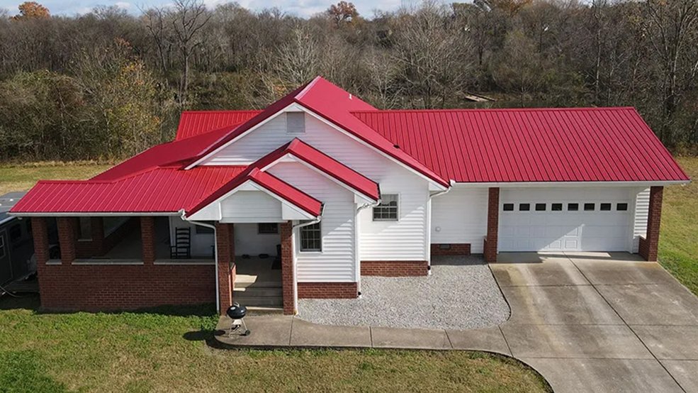 Red traditional metal roof panels on a Tennessee building