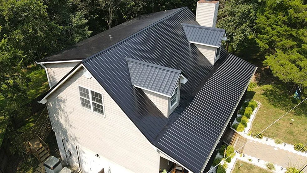 Black traditional metal roof panel finish