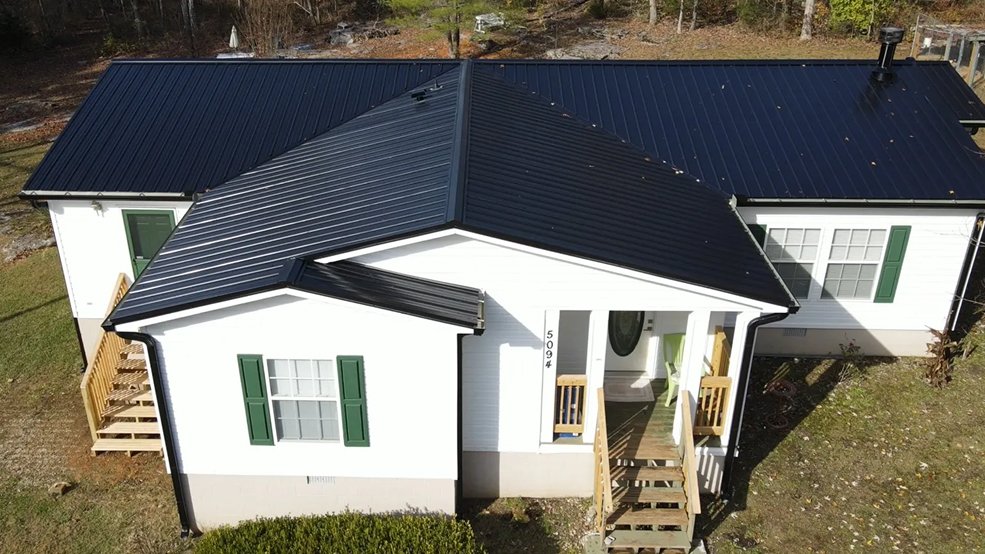 Black traditional exposed fastener metal panel roof