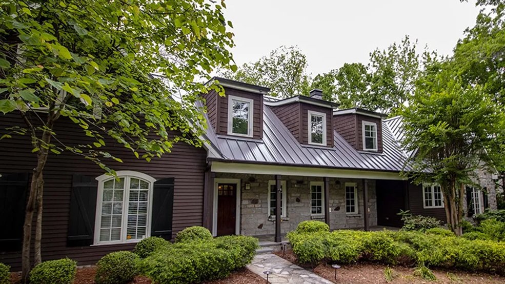 Brown standing seam metal roof panels in sunlight