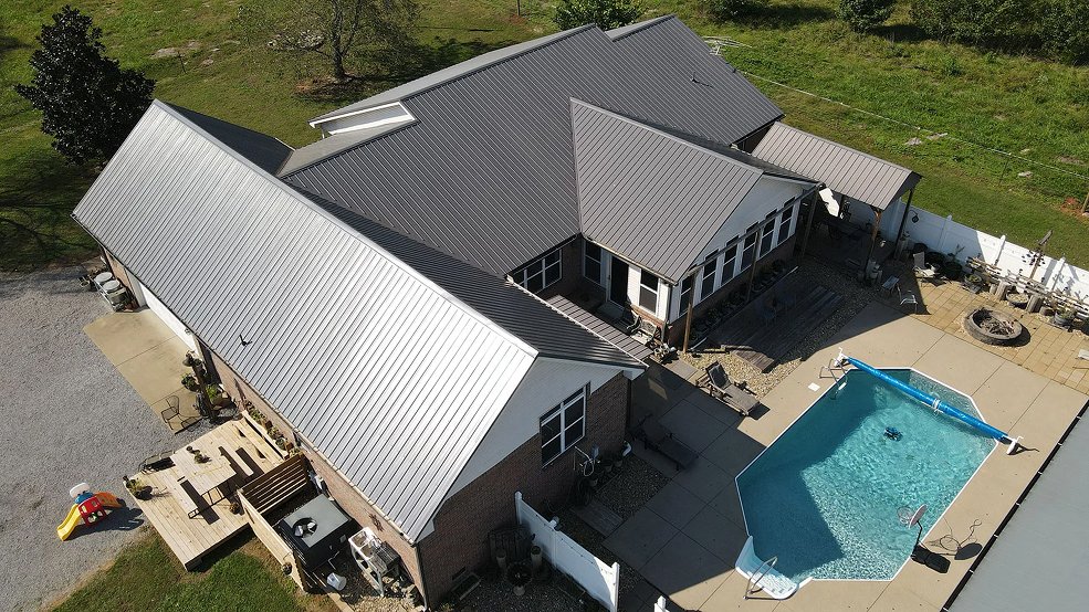 Gray traditional exposed fastener metal panel roof