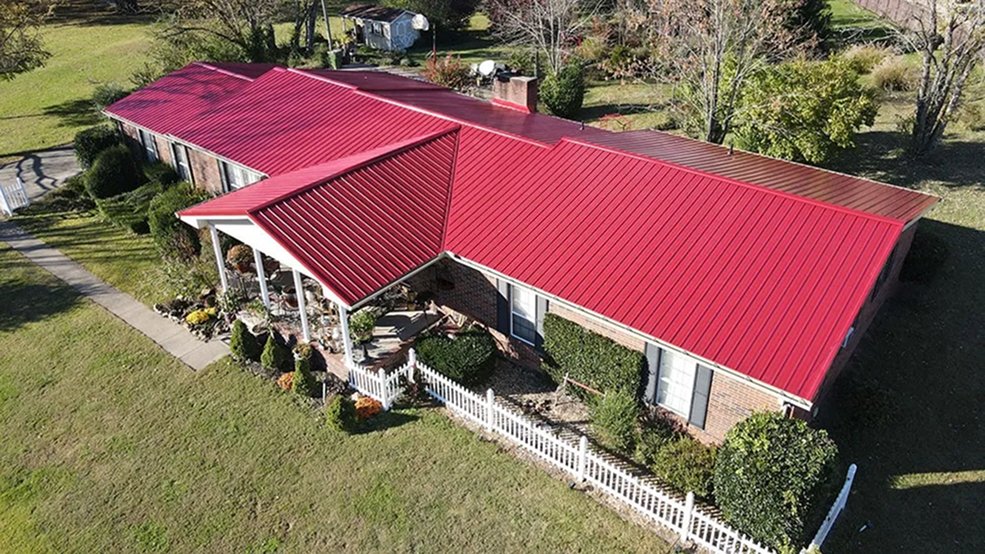 Red traditional metal roofing on a Tennessee building