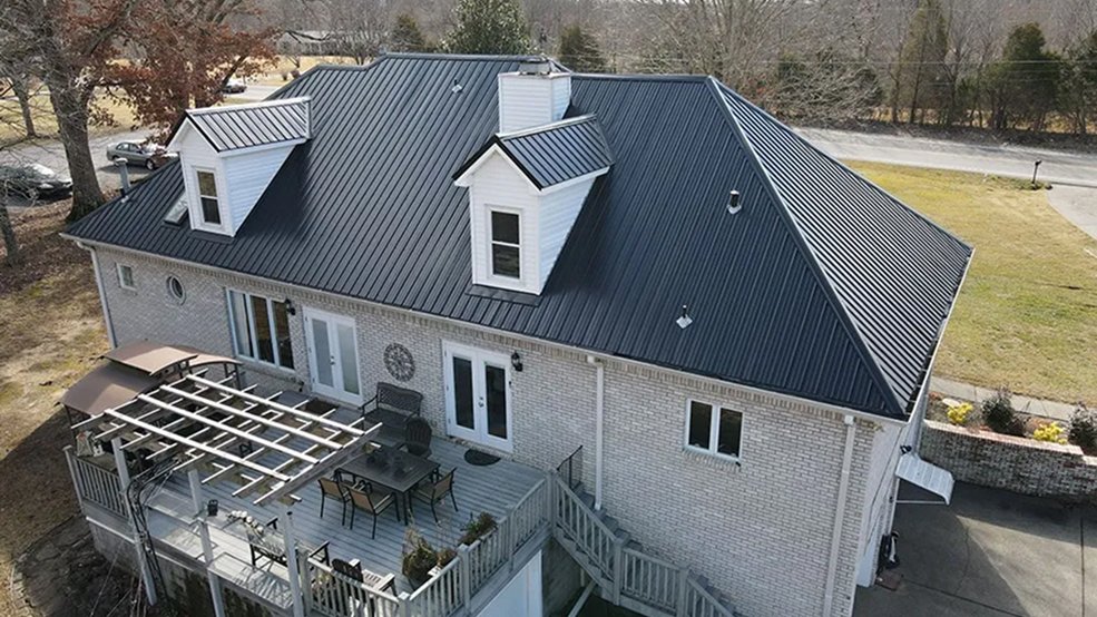Black traditional metal roof panels and eave