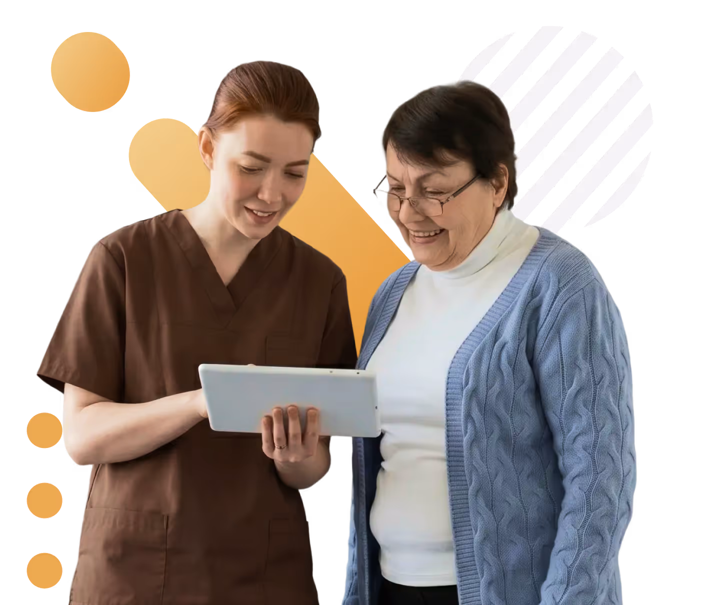 A healthcare worker in brown scrubs shows a tablet to an elderly woman in a blue cardigan.