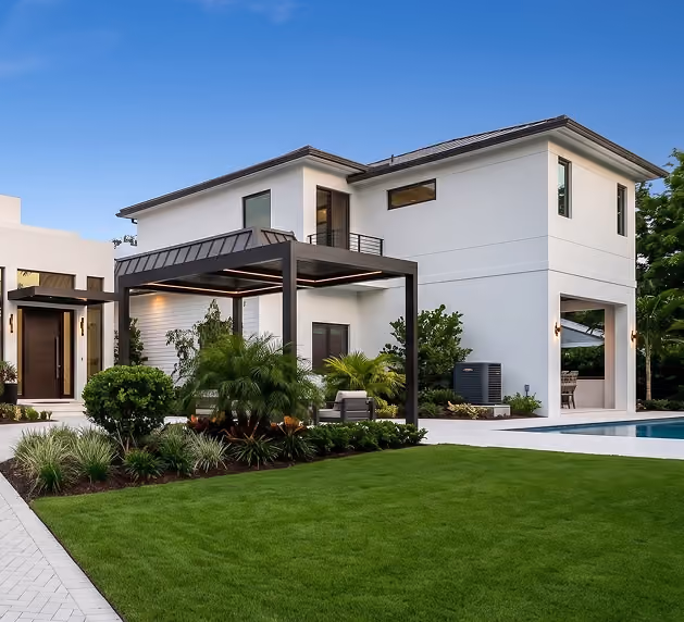 Modern two-story white house with sleek design, by MT Construction Group Miami