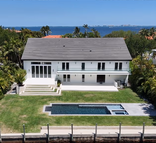 Modern white two-story house with lawn,  by MT Construction Miami