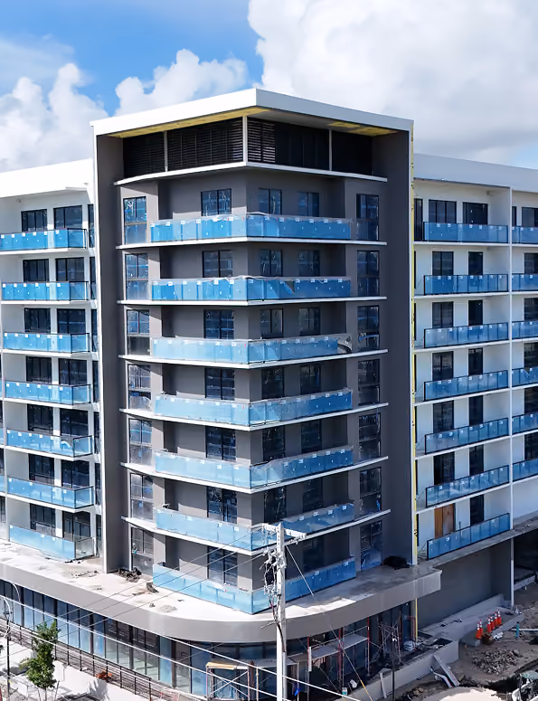 Modern multi-story building under construction  by MT Construction Miami