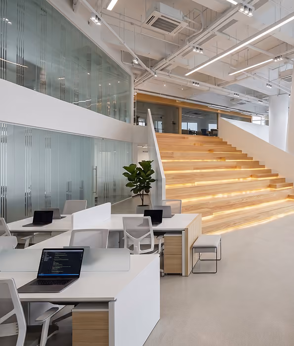 Modern office space with white desks,  by MT Construction Miami