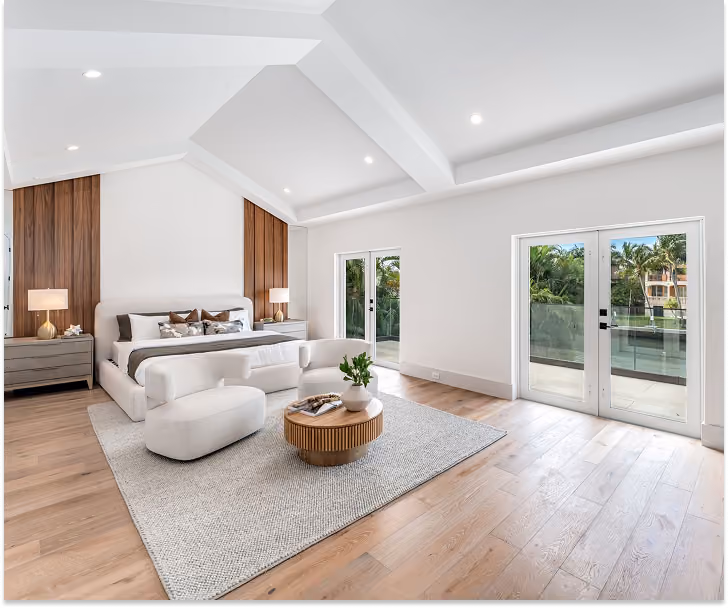 Modern bedroom with vaulted ceiling, wood floor, by MT Construction Group Miami