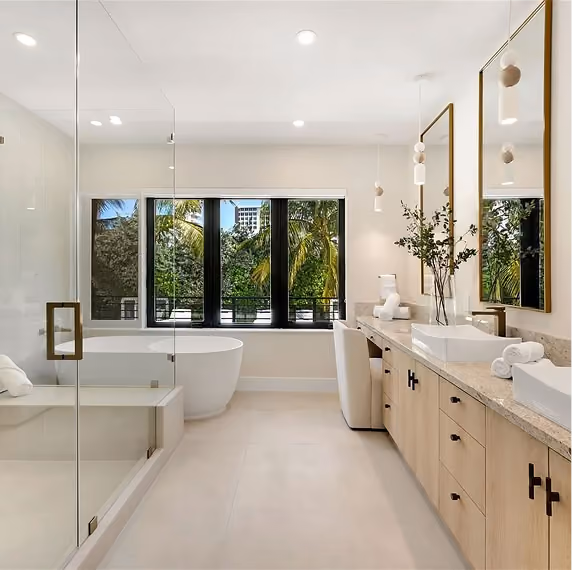 Modern bathroom with glass shower, freestanding tub, by MT Construction Group Miami