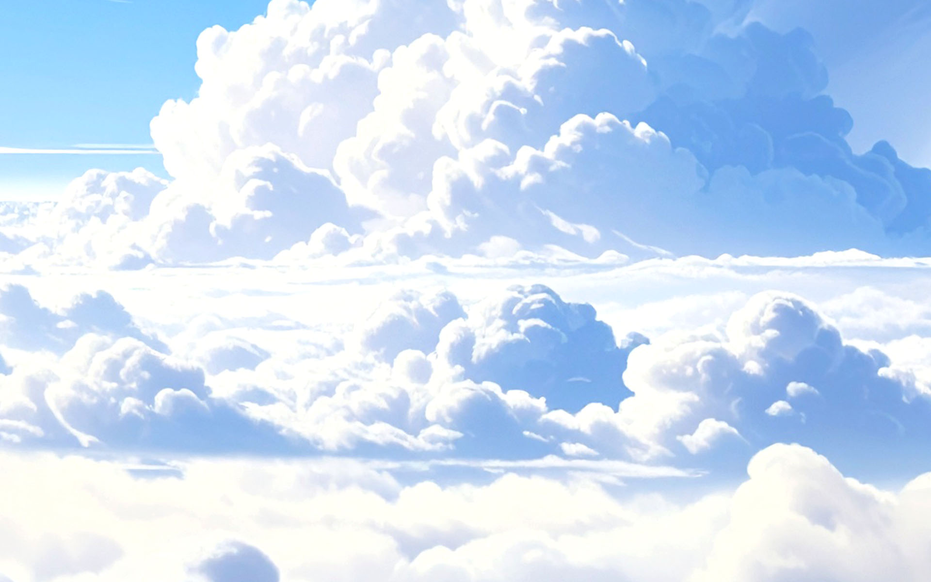Bright blue sky filled with large, fluffy white clouds of various shapes and sizes.