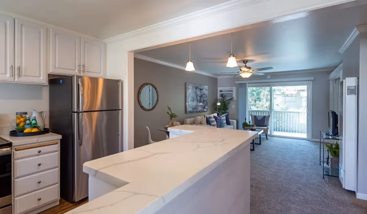 Kitchen with island and living room with couch