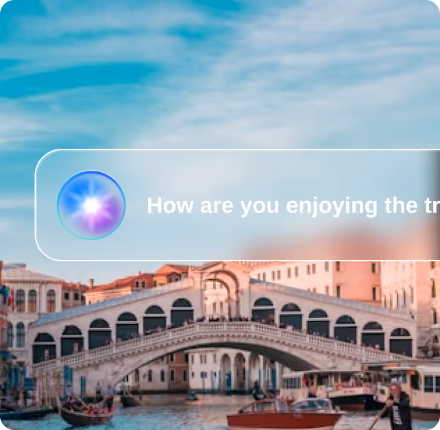View of the Rialto Bridge in Venice with boats on the canal and a translucent speech bubble overlay saying 'How are you enjoying the tr'.