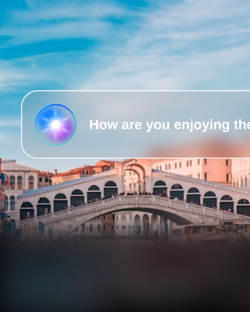 Partial view of the Rialto Bridge over the Grand Canal in Venice with a translucent chat bubble asking 'How are you enjoying the' and an abstract circular icon on the left.