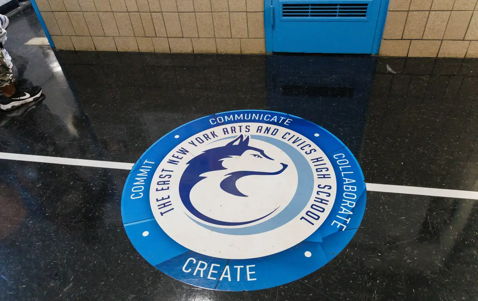 East New York Arts and Civics High School logo on hallway floor