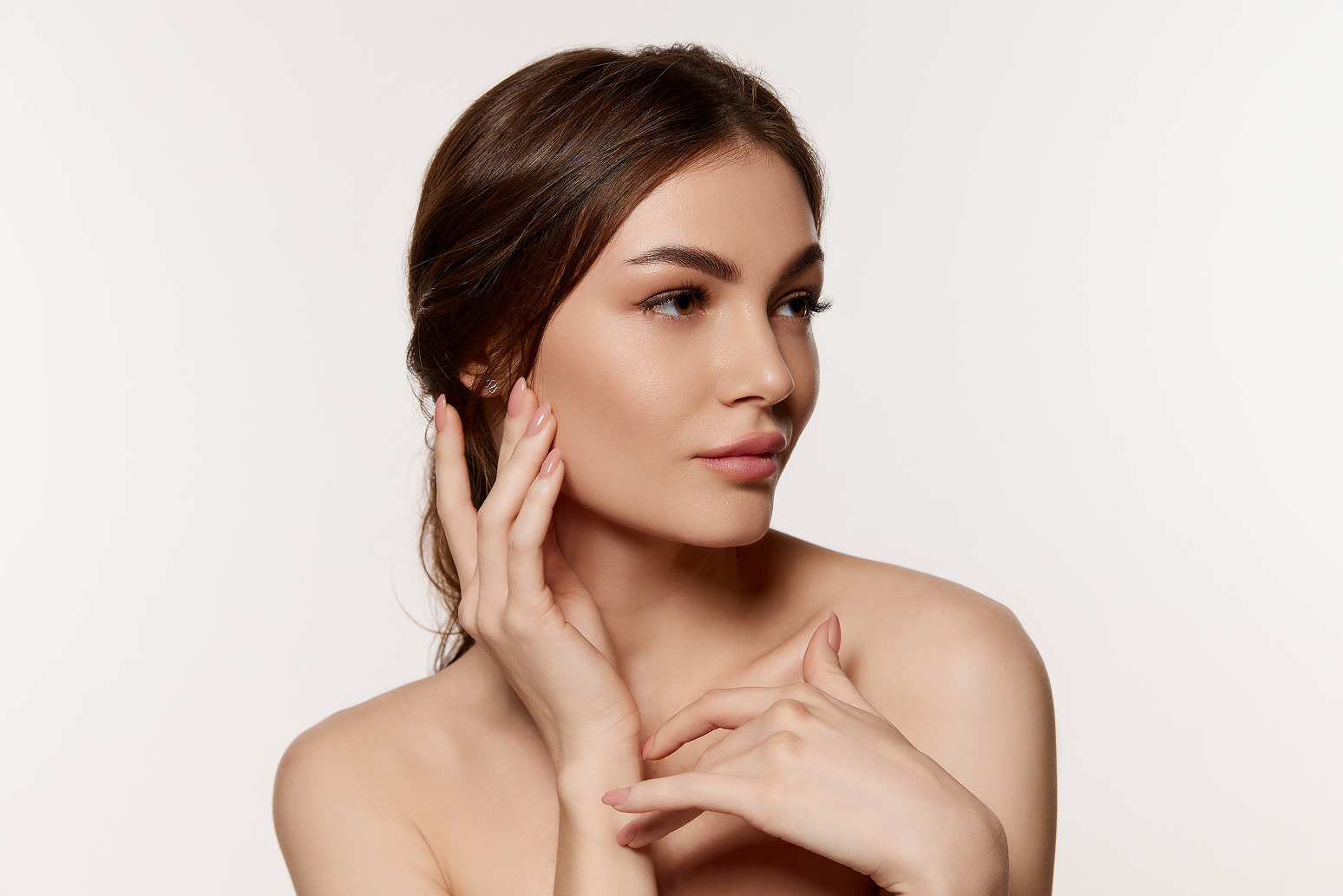 woman touching cheek