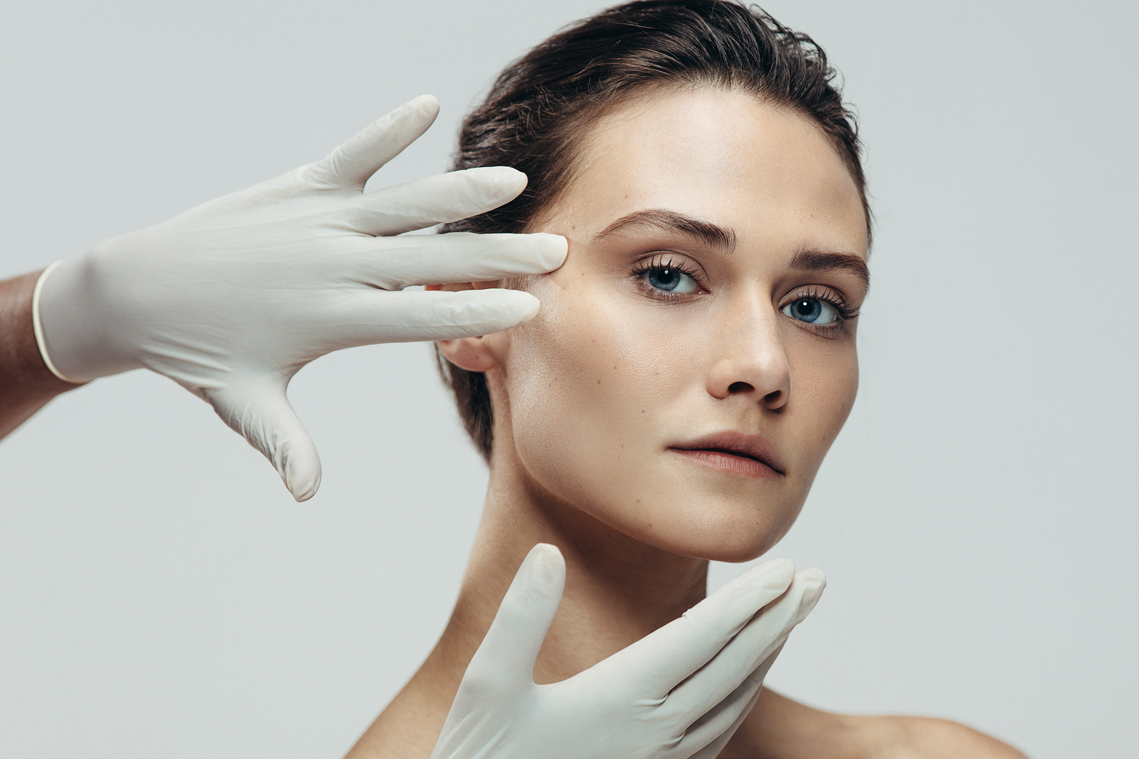 hands touching woman's face