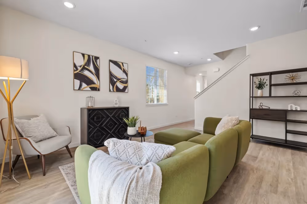 Living room with green couch and decor
