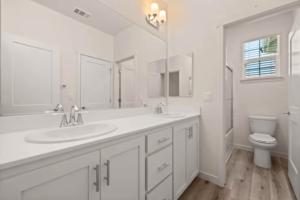 Bathroom with white cabinets