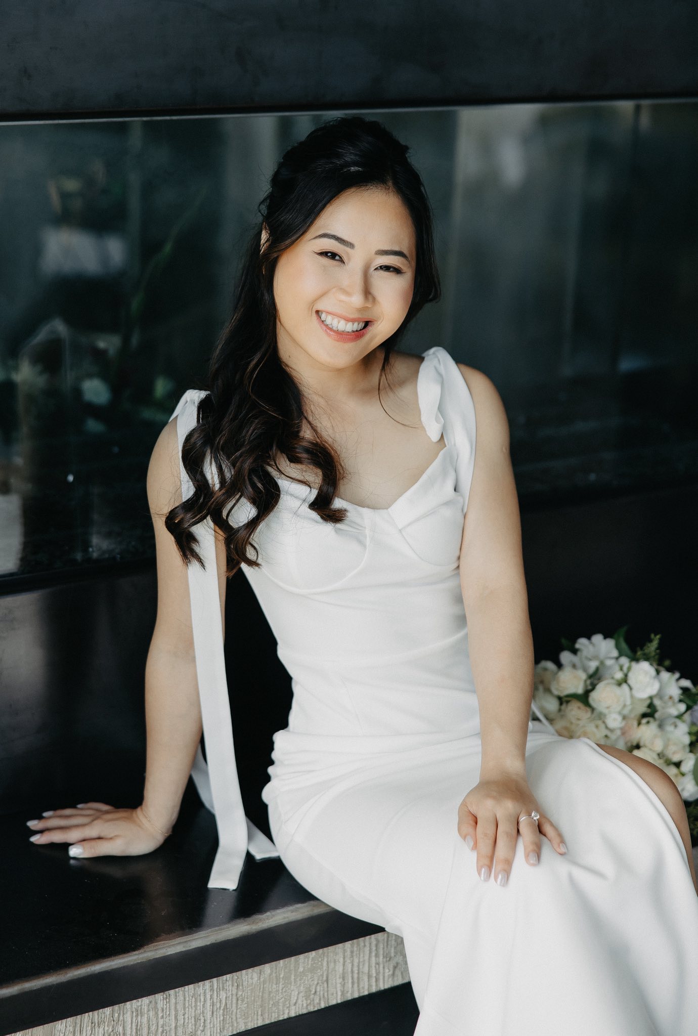 Bride seated in white wedding dress portrait