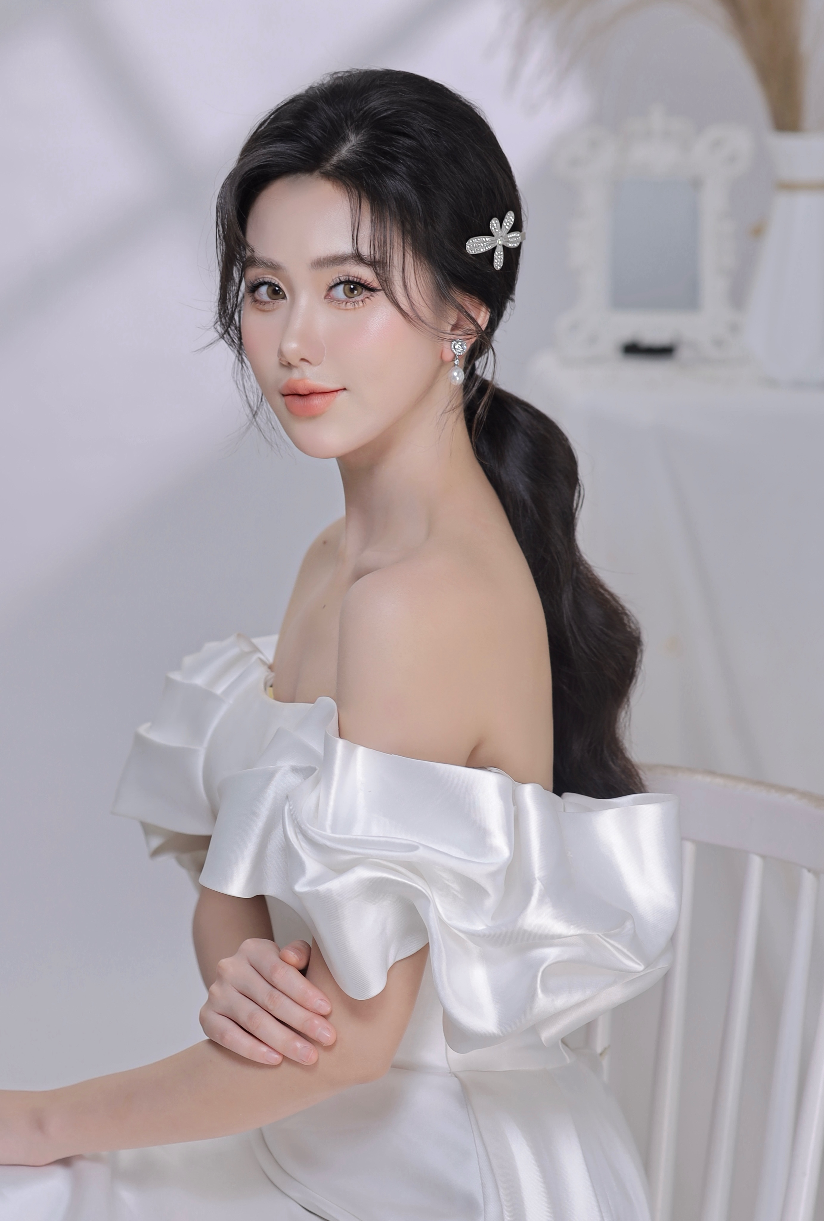 Glam bridal hairstyle portrait with warm indoor lighting