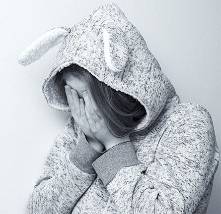 Young girl mourning over the loss of a close family member.