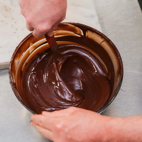 Conexion Chocolate being stirred in a bowl