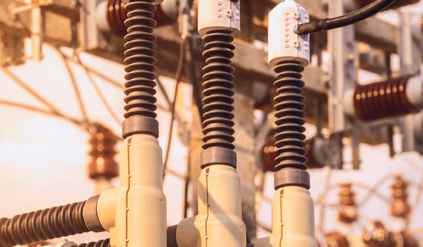 Rows of illuminated server racks inside a large-scale data center facility.
