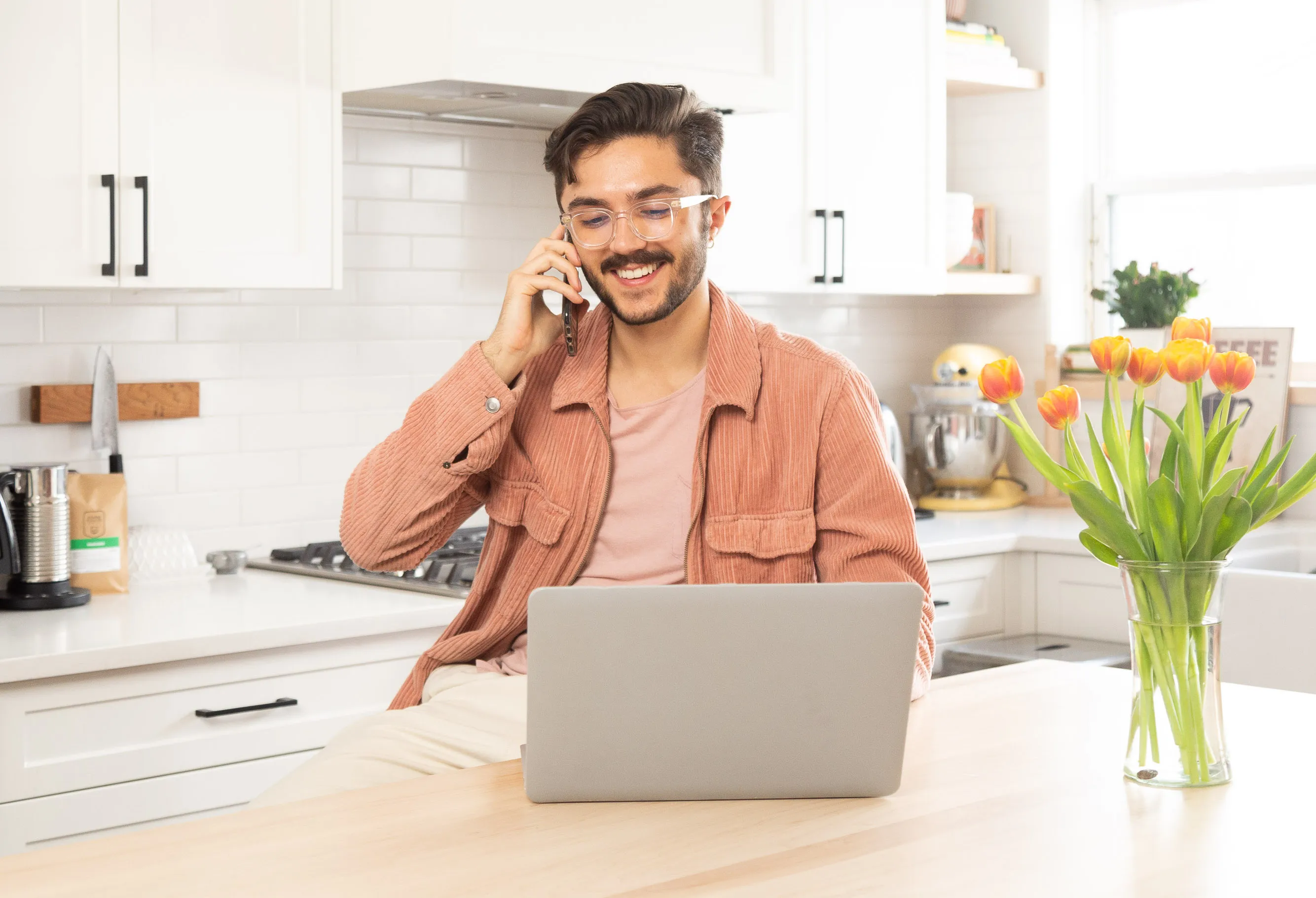 Male model smiling and talking with the doctor over the phone