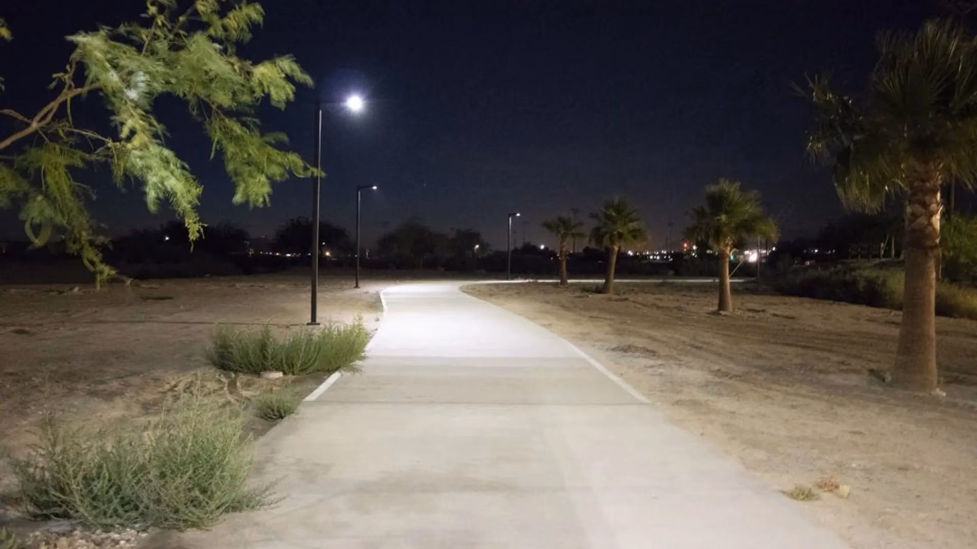 FLT solar area light installed along desert park pathway in dry climate