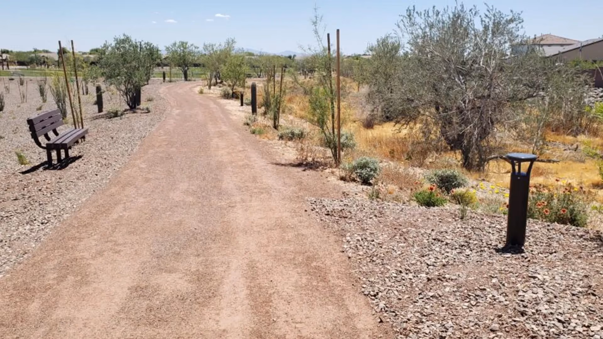 FLT solar bollard lights lining residential HOA community pathway