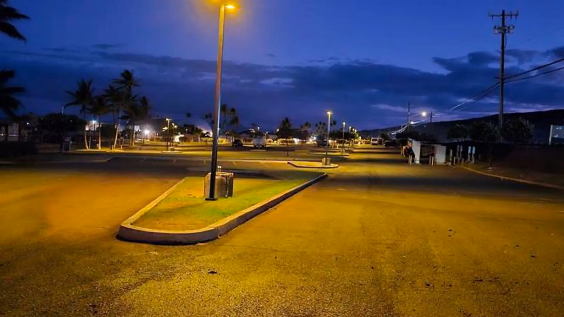 FLT DarkSky-compliant solar light installed in Hawaii parking lot near coastline