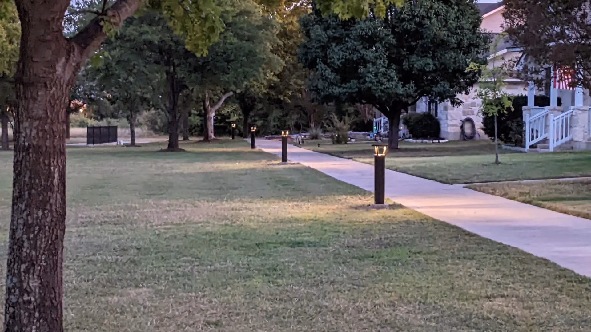 FLT solar bollard light installed in residential HOA community pathway