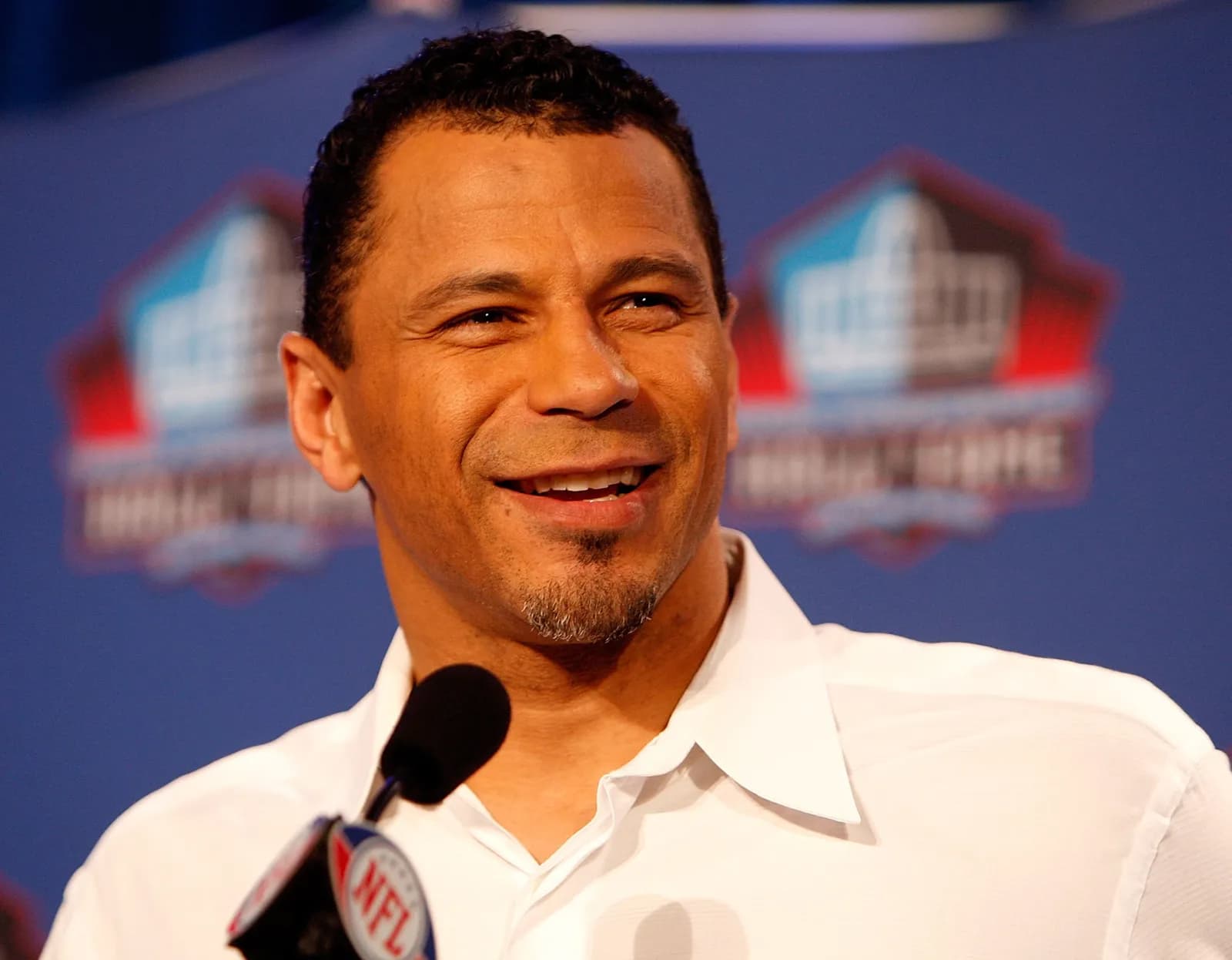 Rod Woodson, co-founder of Mercy Munch smiling into microphone