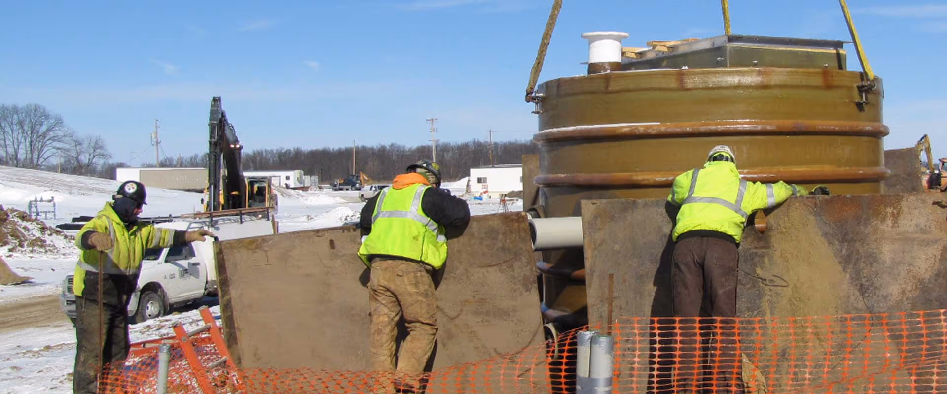 Wenger Excavating crew members installing underground utility infrastructure on a commercial construction project in Ohio.