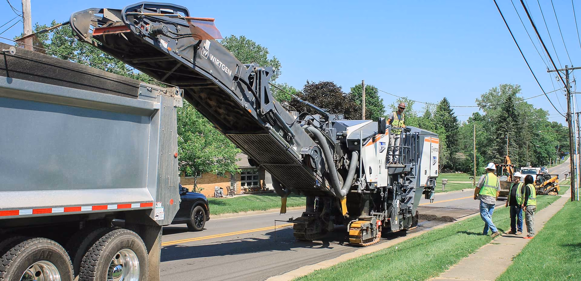 Northstar Asphalt crew performing asphalt paving with commercial paving equipment.