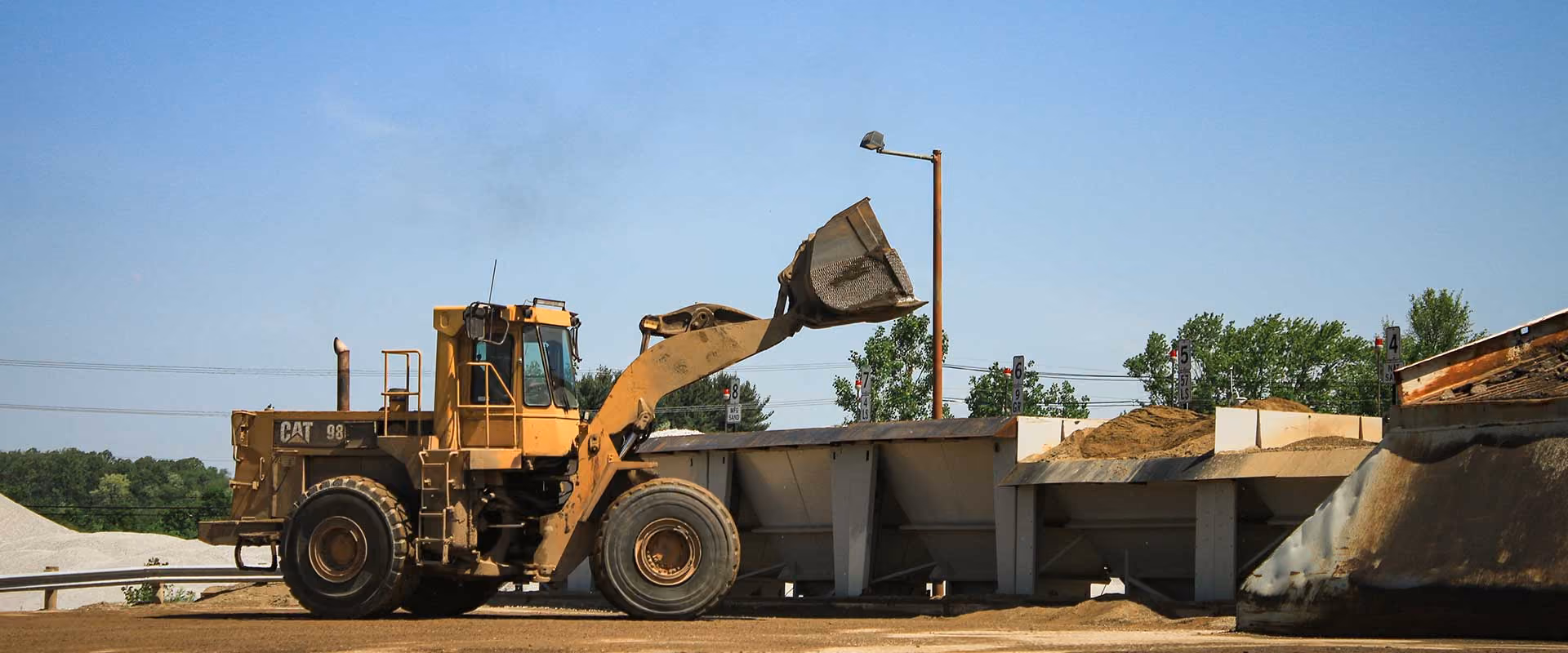 Wheel loader operating at the Massillon Materials aggregate yard, supporting construction material production and distribution.