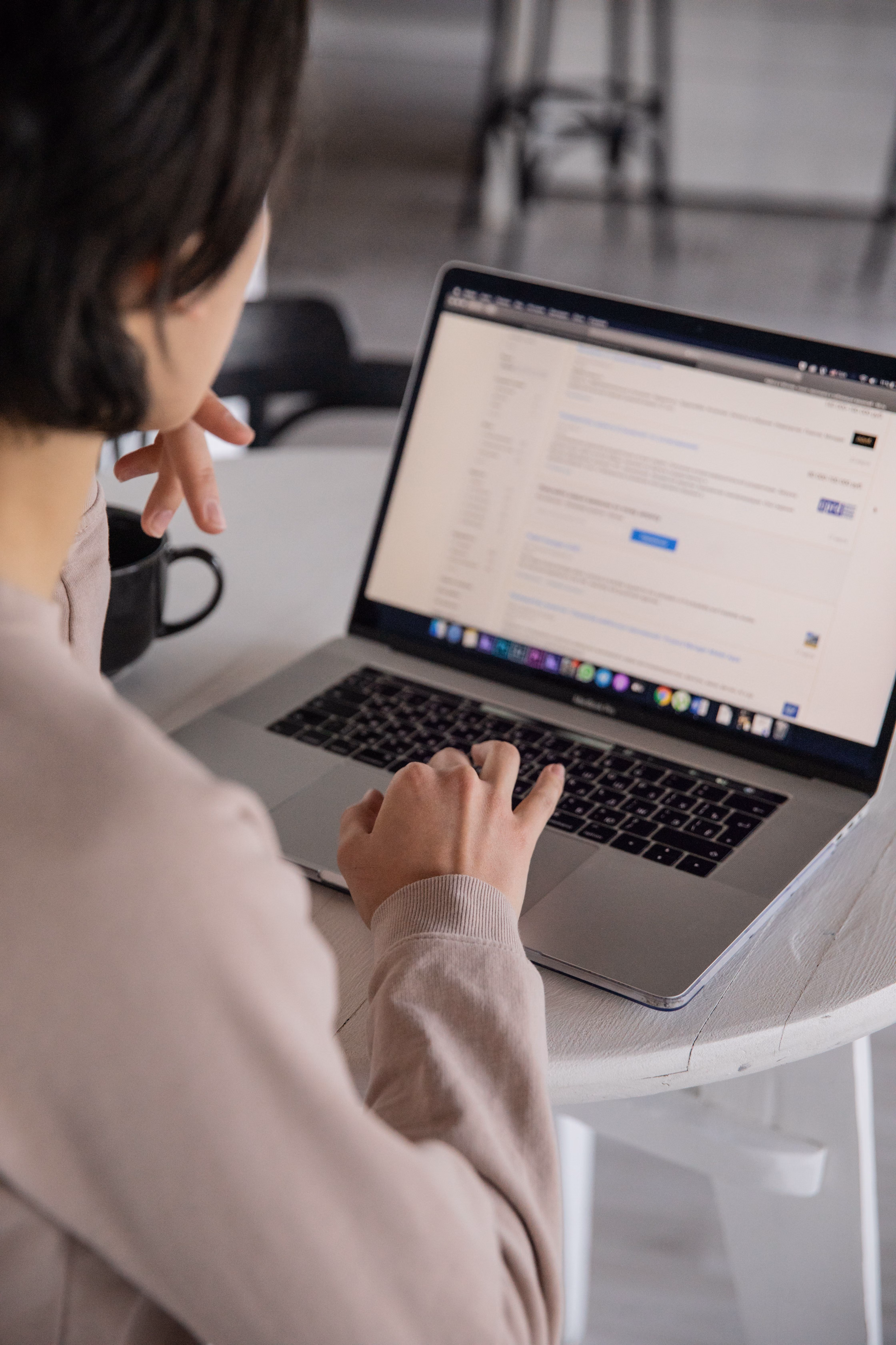 Person searching on their computer.