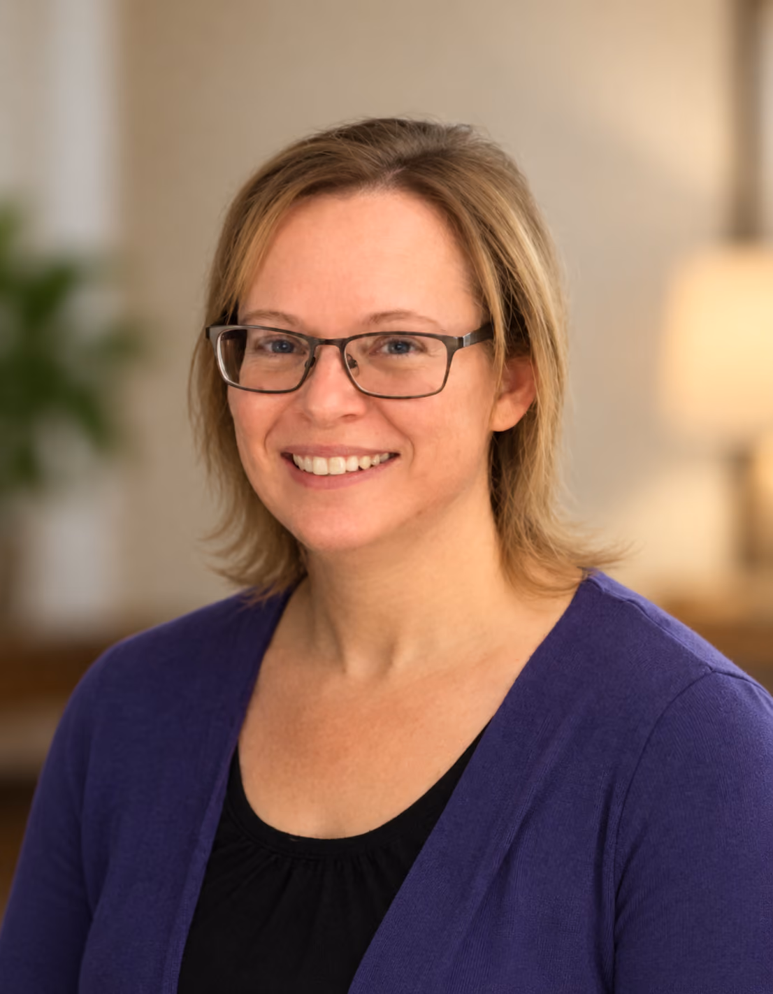 Warm Professional Portrait of Cynthia with Purple Cardigan