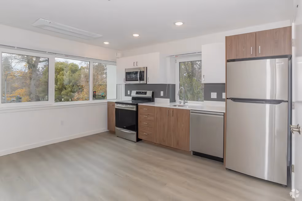 Kitchen with brown cabinets and stainless steel appliances