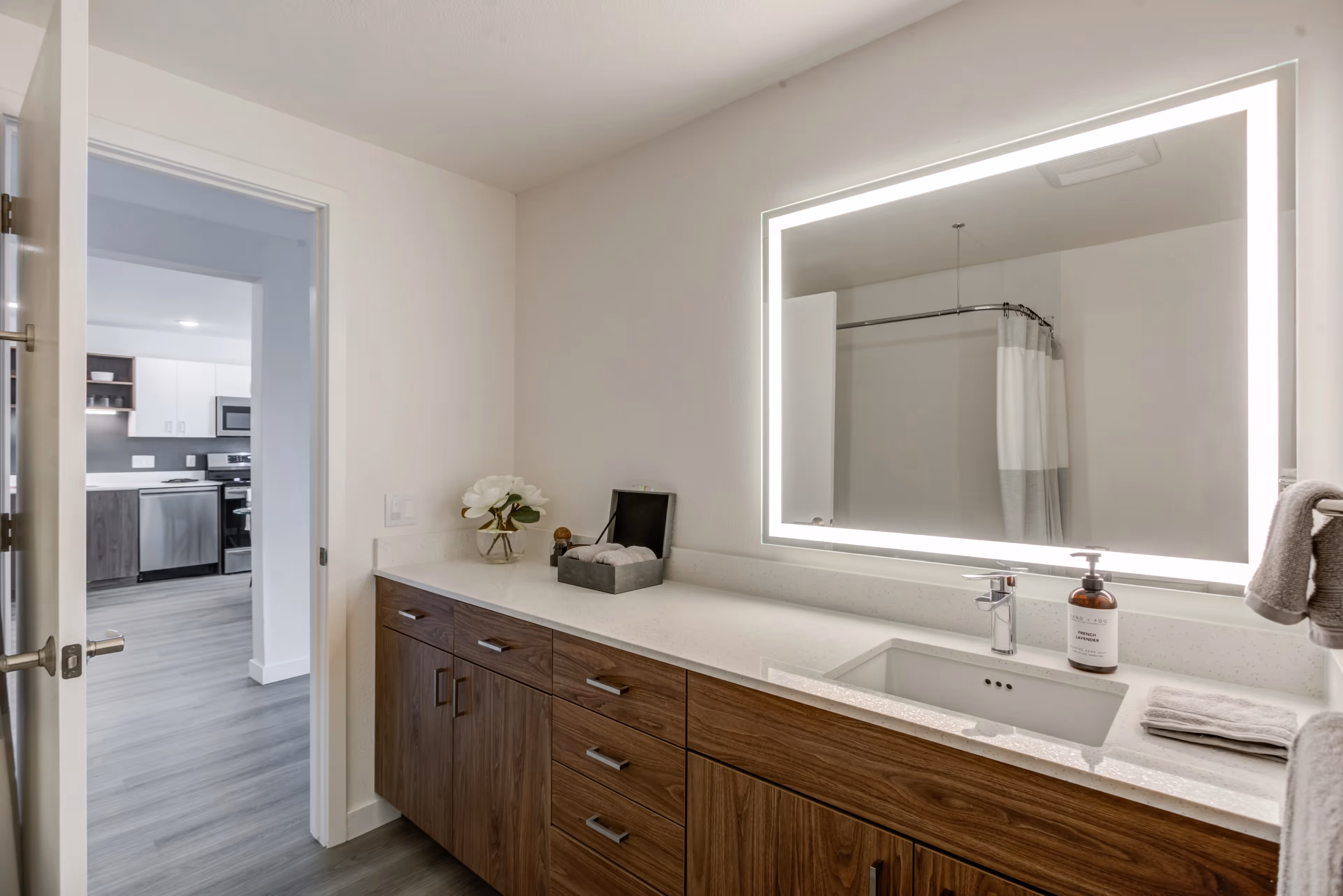Bathroom with vanity and light up mirror