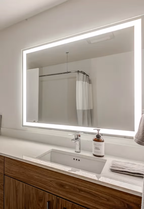 Bathroom with vanity and light up mirror