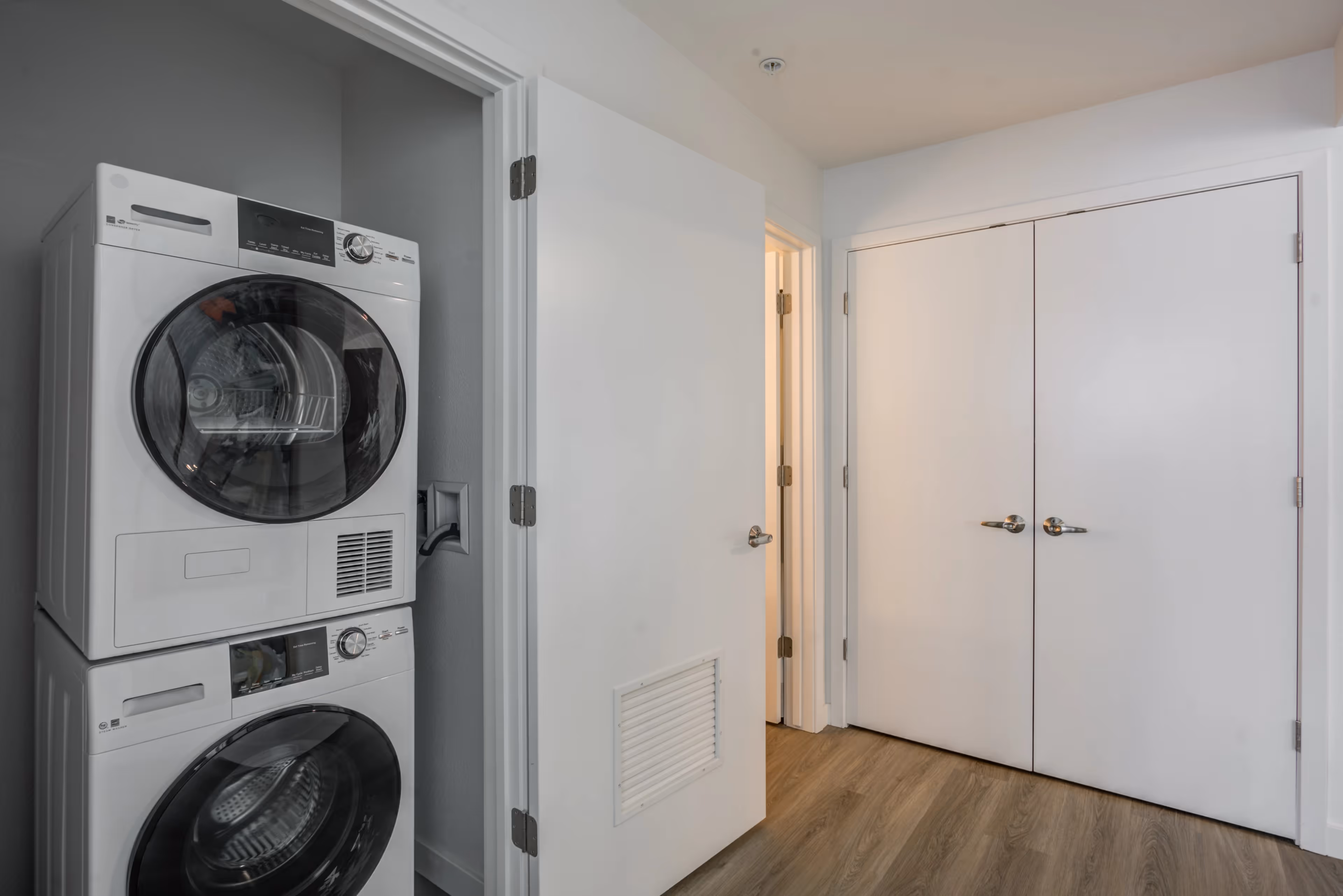 Stacked washer and dryer in unit
