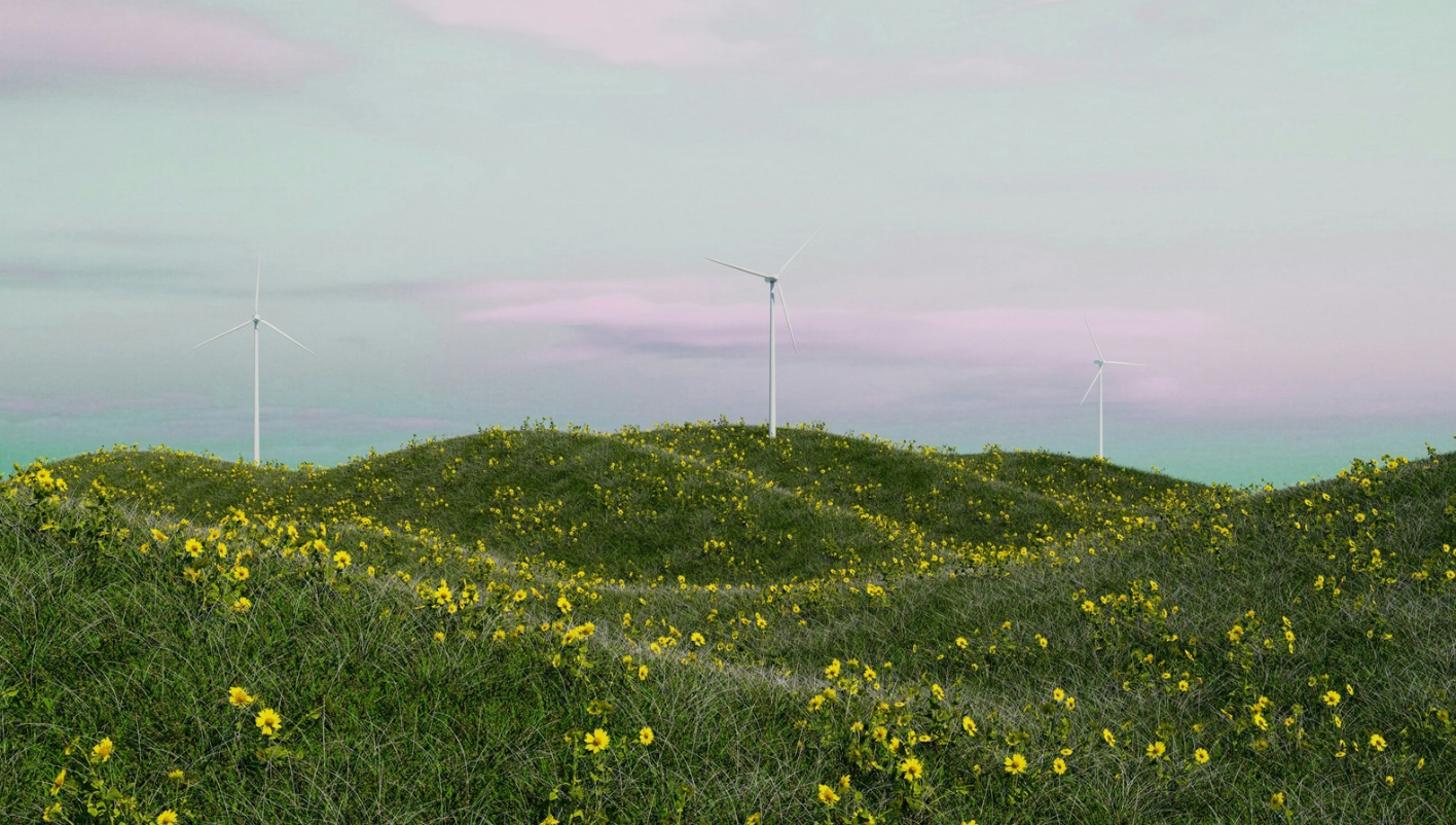 Wind turbines across a wind farm surrounded by wildflowers and green vegetation.